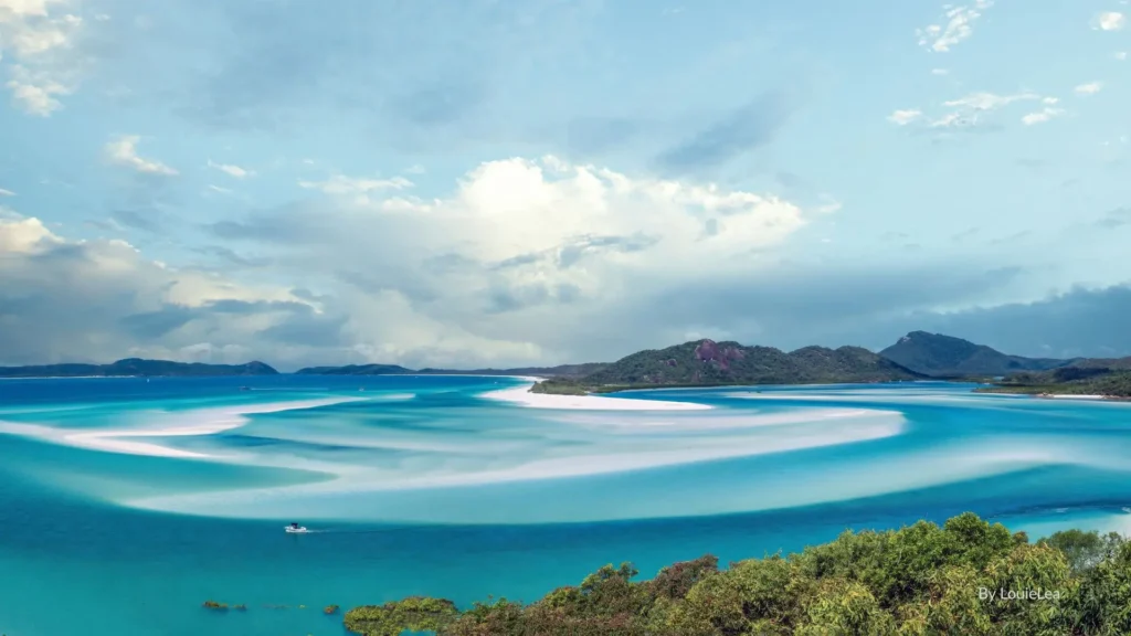 Aerial view of Whitehaven Beach with swirling white silica sand and turquoise waters on Whitsunday Island, Queensland, Australia.